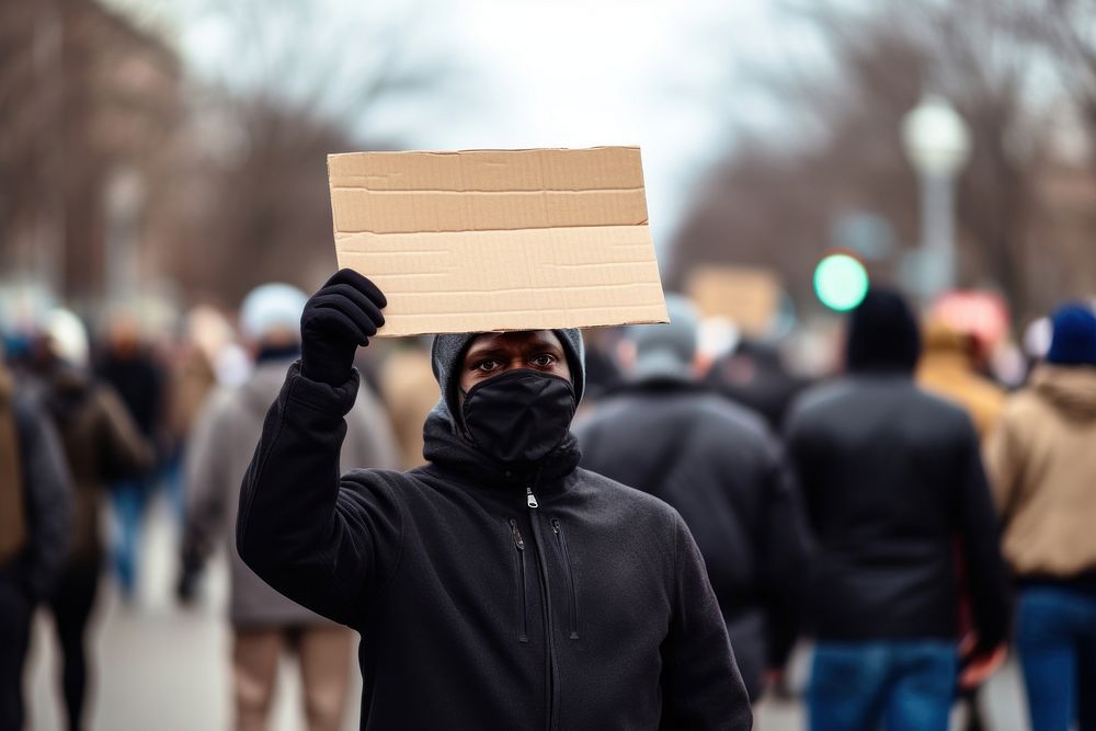 Middle-aged black man holding a blank cardboard sign protest adult architecture. AI generated Image by rawpixel.