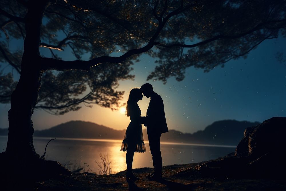 Couple kissing under the moon light backlighting silhouette outdoors. AI generated Image by rawpixel.