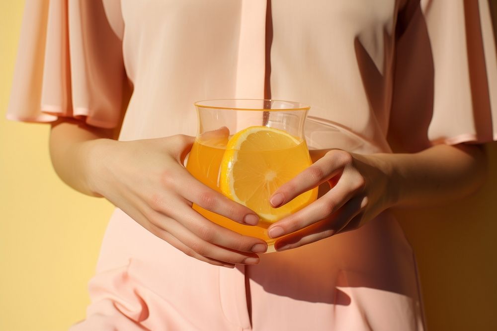 Female holding clear pitcher of water yellow drink fruit. AI generated Image by rawpixel.