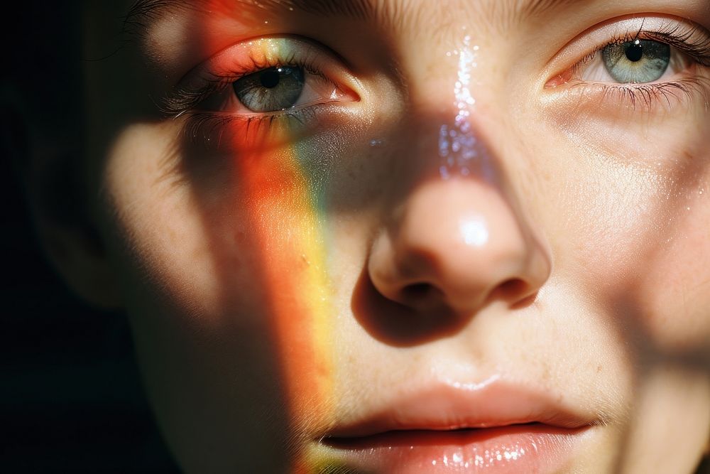 Rainbow light on woman face photography portrait skin. AI generated Image by rawpixel.