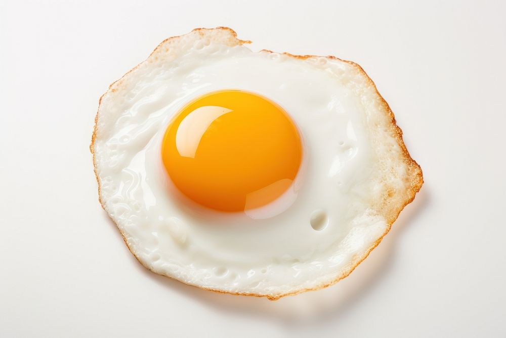A fried egg food white background breakfast. AI generated Image by rawpixel.