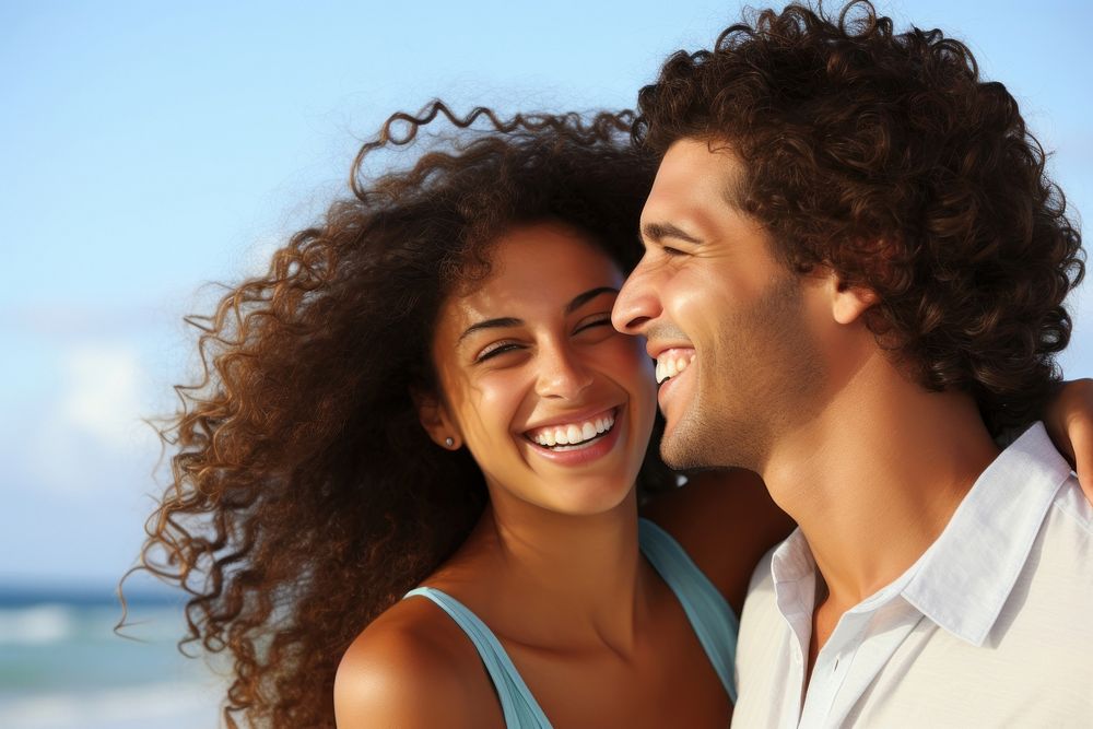 Hispanic couple hanging out at the beach together laughing smile adult. AI generated Image by rawpixel.
