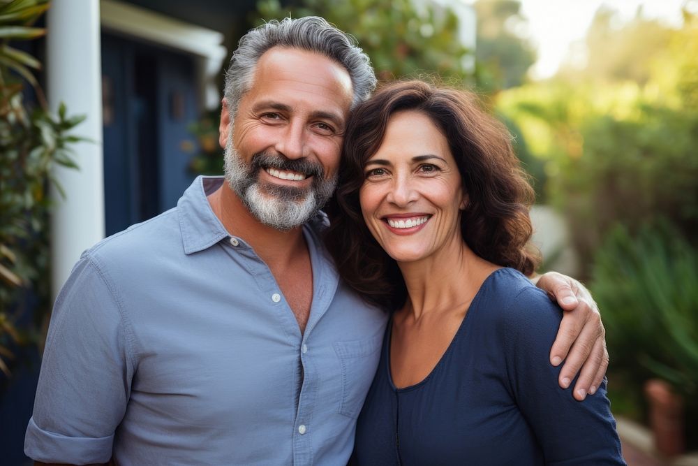 Middle-aged hispanic couple smiling together laughing portrait outdoors. AI generated Image by rawpixel.