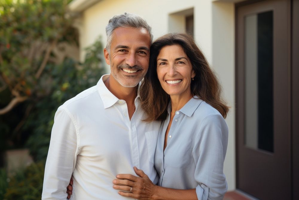 Middle-aged hispanic couple smiling together outdoors people adult. AI generated Image by rawpixel.