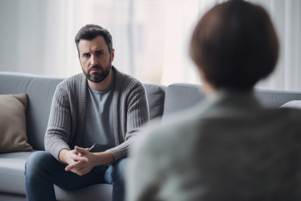 Therapist talking to sad patient conversation interview adult. AI generated Image by rawpixel.