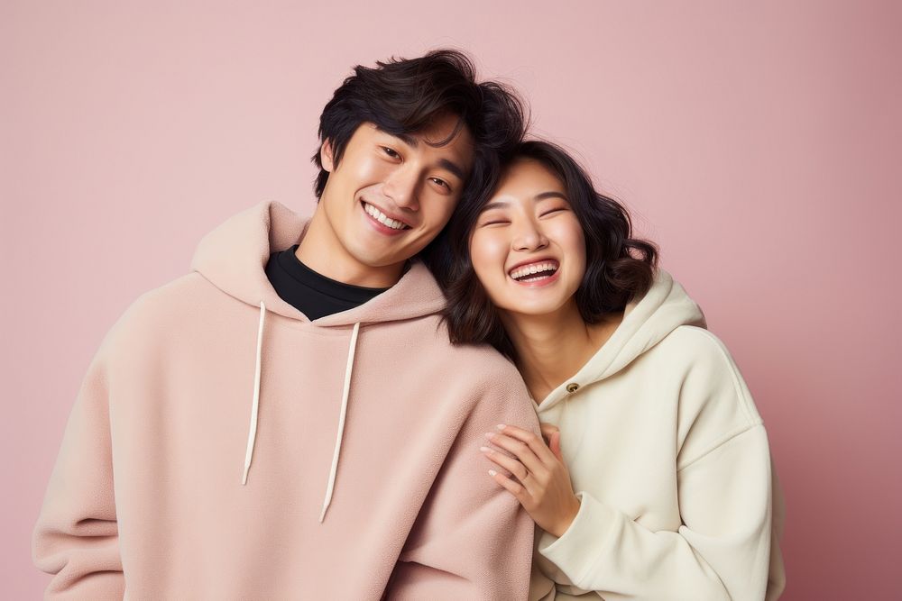 Young asian couple sweatshirt laughing sweater. AI generated Image by rawpixel.