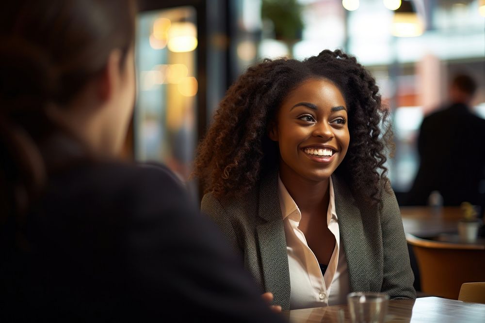 African American woman talking meeting person. AI generated Image by rawpixel.
