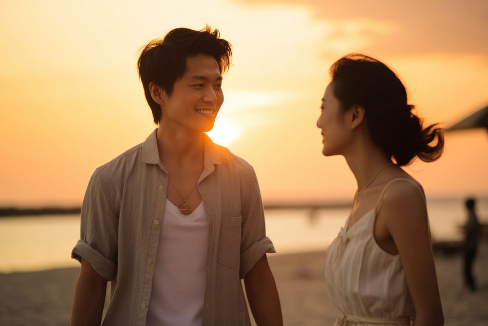 Asian couple enjoyment sunset outdoors nature beach. AI generated Image by rawpixel.