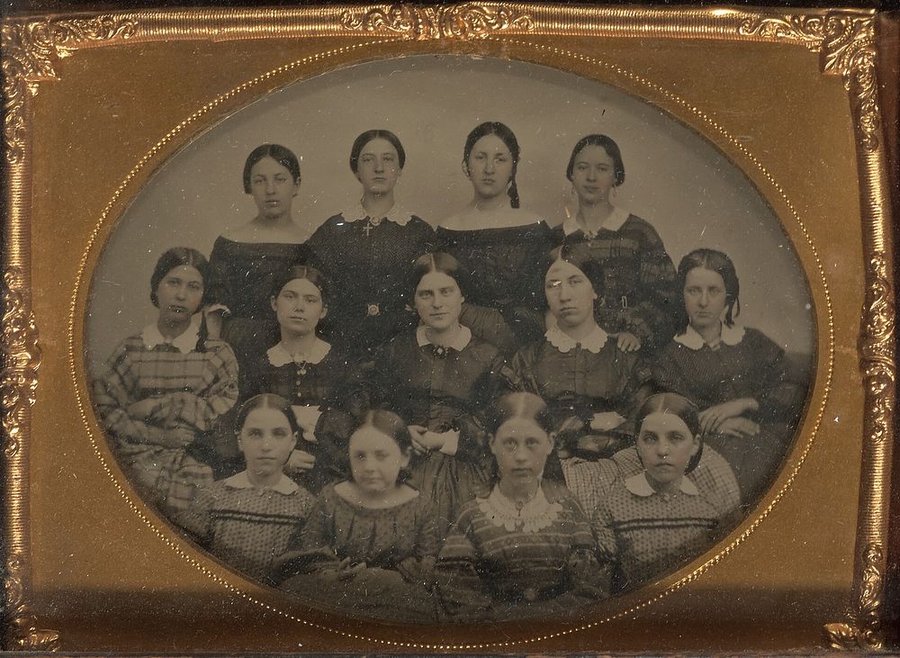 Group portrait of thirteen young women