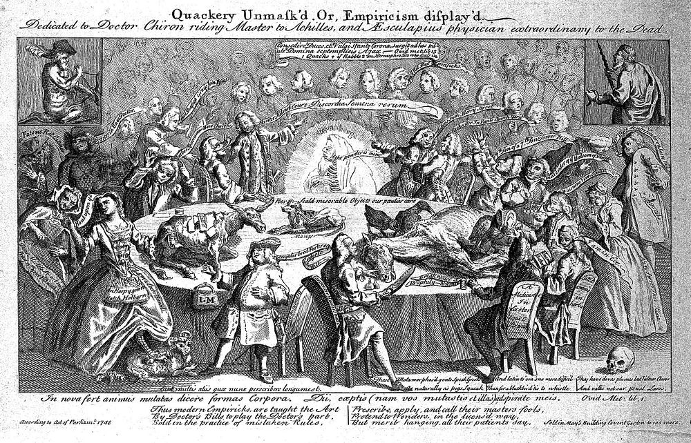 A large table in a lecture hall with many commercial medicine vendors and practitioners seated around it: in the background…
