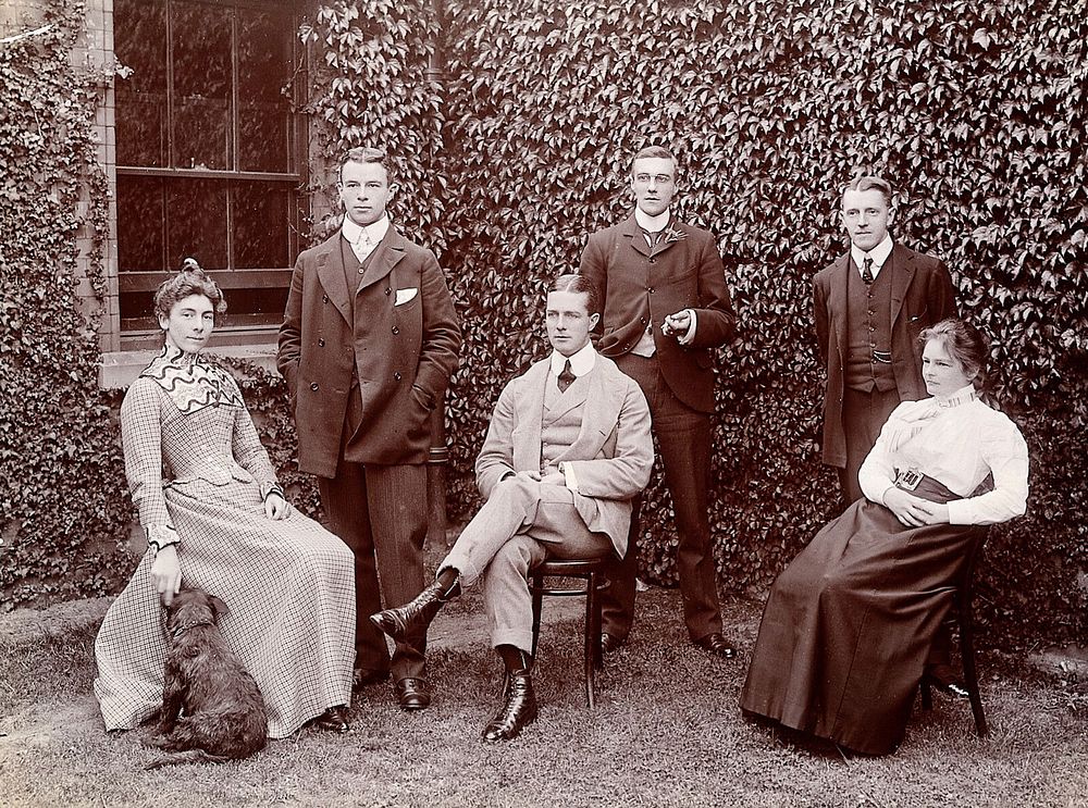 Claybury Asylum, Woodford, Essex: six members of staff, and a dog. Photograph by the London & County Photographic Co.…