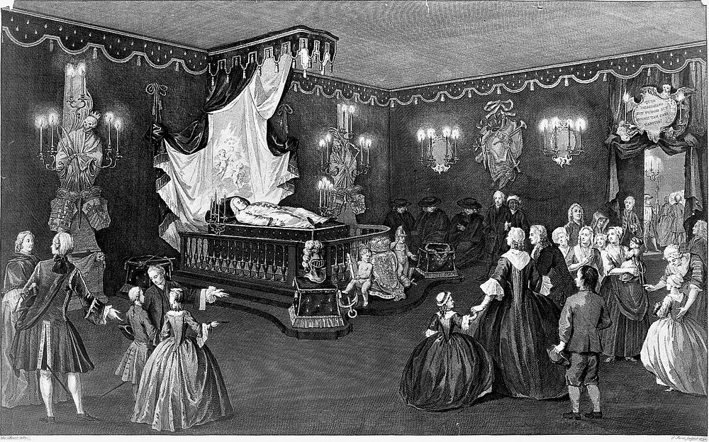 The lying in state of Willem IV, Prince of Orange-Nassau, surrounded by his grieving family and servants. Line engraving…