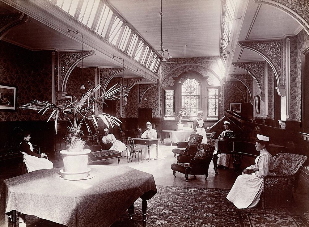 Claybury Asylum, Woodford, Essex: a nurses' day-room  Photograph by the London & County Photographic Co., [1893].
