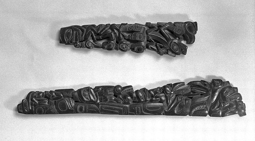 Pipe, argillite shale, very fine carving with intricately interlacing totemic figures of animals and supernatural creatures.…