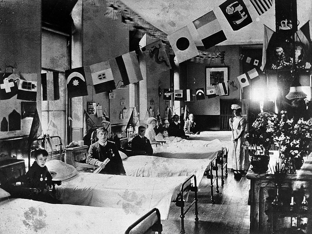 Hahnemann Hospital and Homœopathic Dispensaries, Liverpool: a ward, decorated with flags possibly for the coronation of King…
