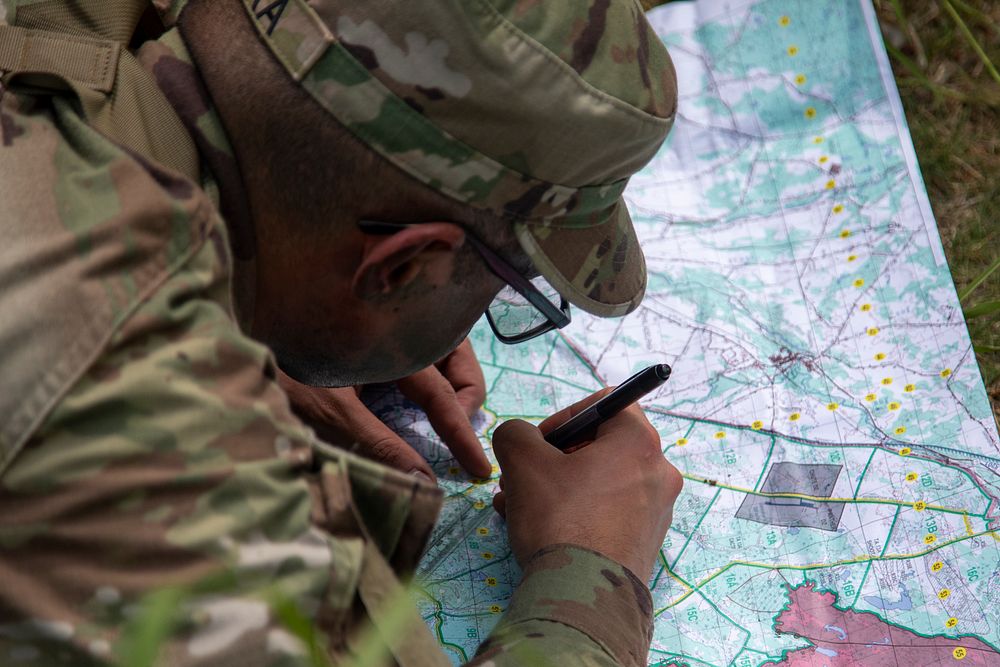 Military officer with map. Original public domain image from Flickr