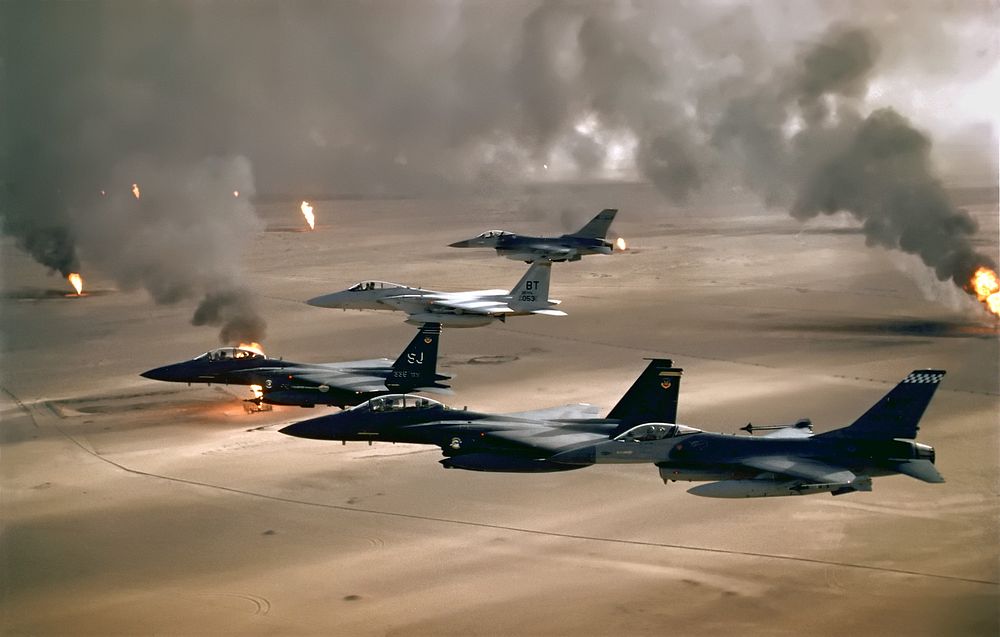 USAF aircraft of the 4th Fighter Wing (F-16, F-15C and F-15E) fly over Kuwaiti oil fires, set by the retreating Iraqi army…