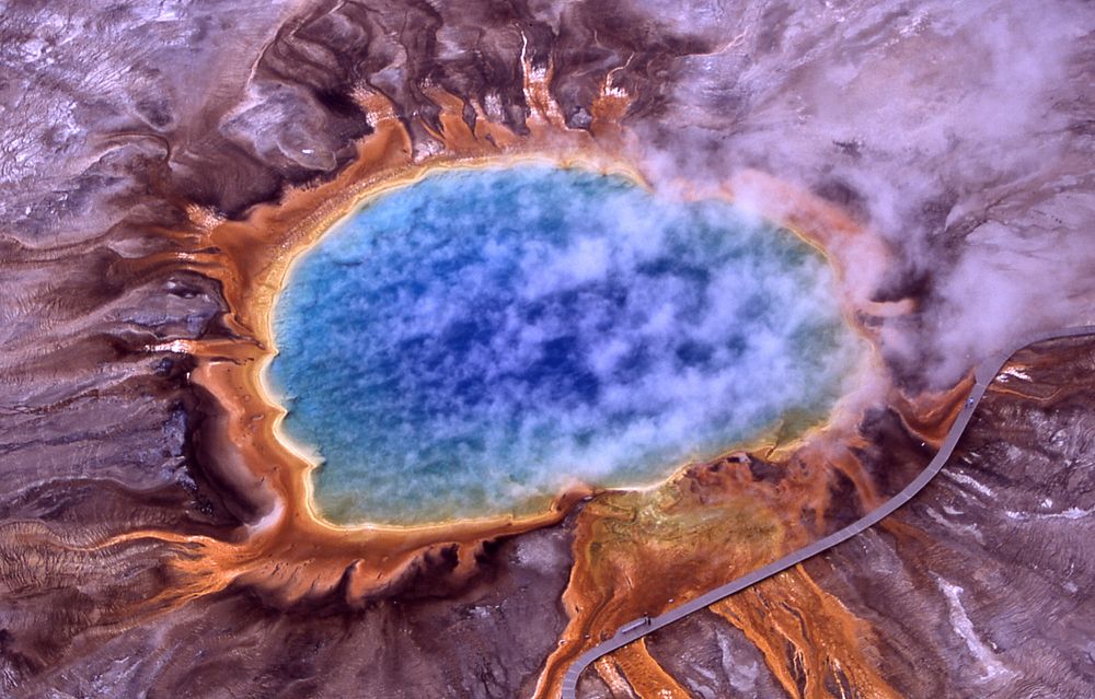 Aerial view of Grand Prismatic Spring; Hot Springs, Midway & Lower Geyser Basin, Yellowstone National Park. The spring is…