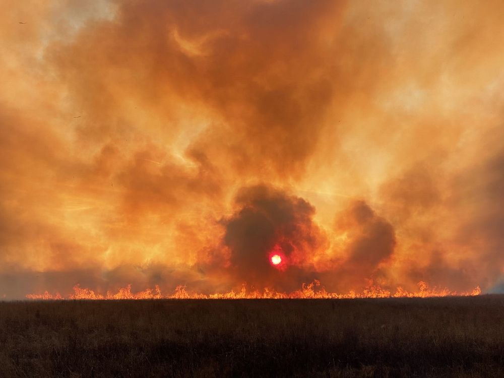 Weather Category - USFWS 2022 Photo/Video ContestSmoke turns the sun red during a prescribed fire at Great Swamp National…