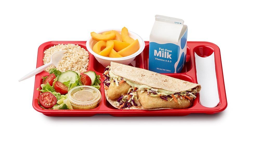 A school lunch tray showing a reimbursable meal for grades 9 through 12 served by the Kittery School District in Maine. Also…