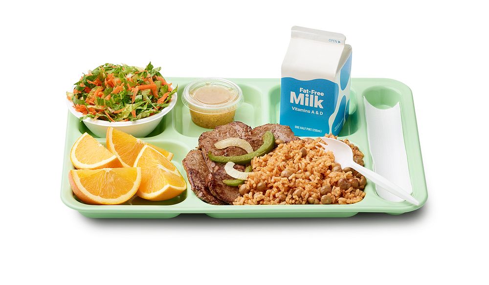 A school lunch tray showing a reimbursable meal for grades 9 through 12 served by Christian Military Academy in Puerto Rico.…