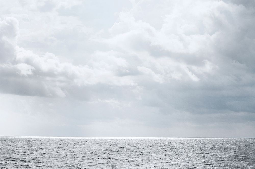Calm ocean under the cloudy sky, free public domain CC0 photo.