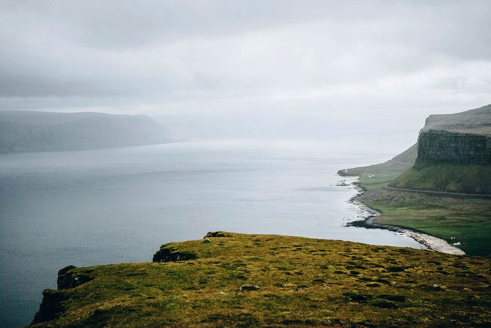 Foggy, misty lake with cliffs, free public domain CC0 photo.