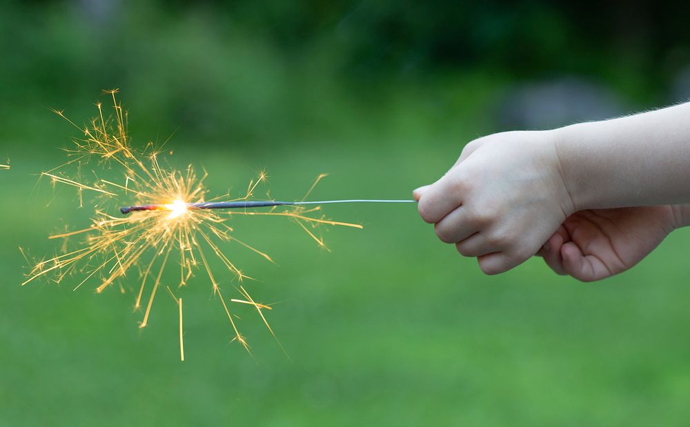 Free hand holding fire sparklers image, public domain people CC0 photo.