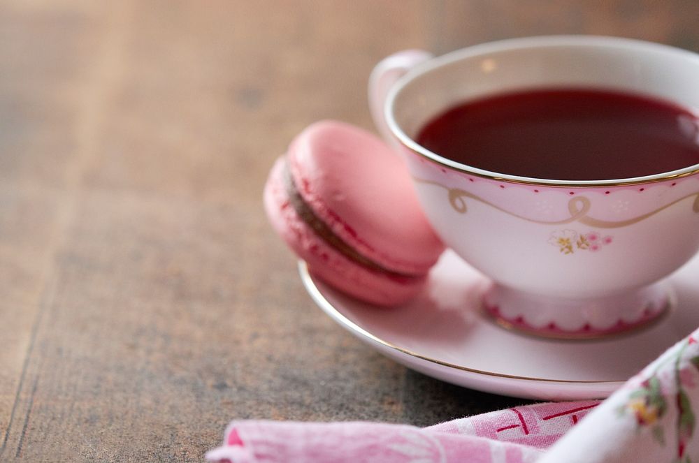 Free red tea and macaron on wooden table photo, public domain beverage CC0 image.