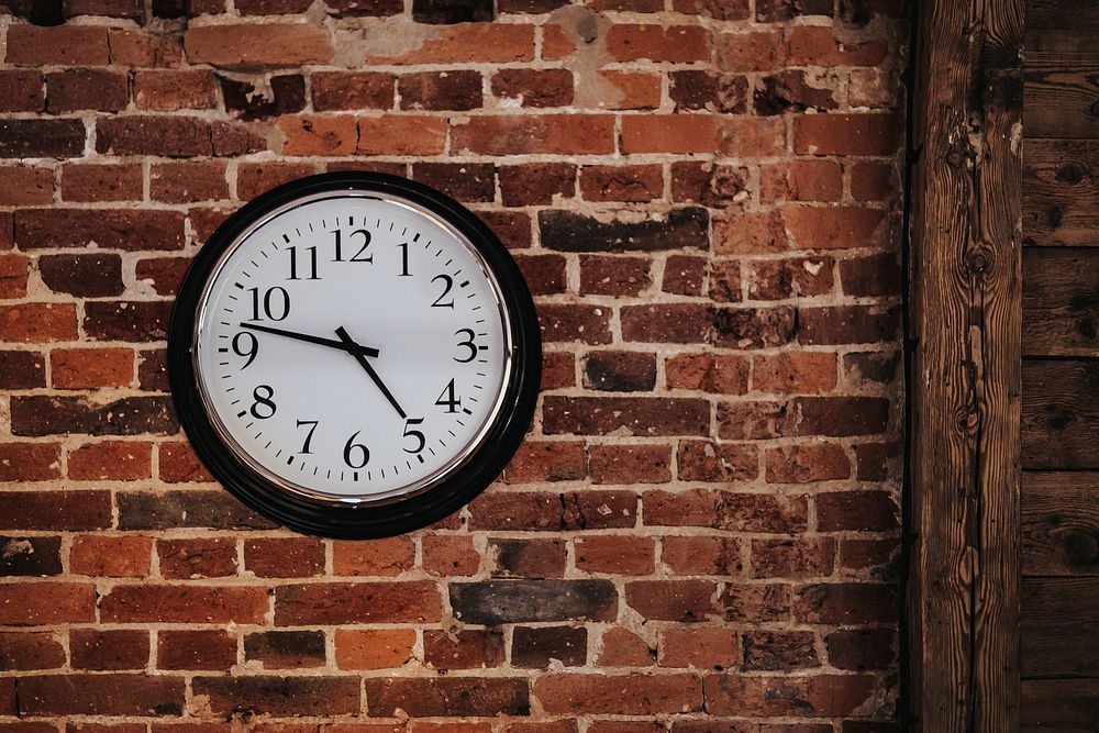 Clock on brick wall, free public domain CC0 photo