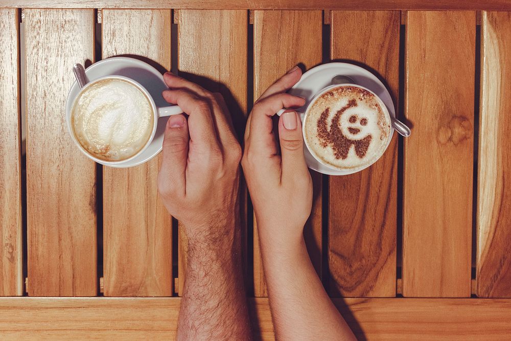 Free romantic couple with cappuccino on wooden table photo, public domain beverage CC0 image.