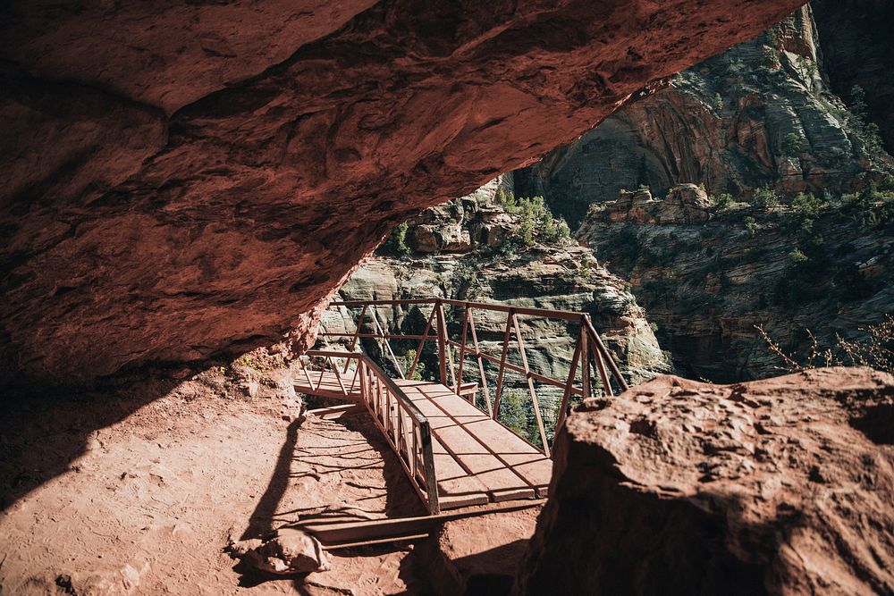 Free bridge through canyon caves image, public domain travel CC0 photo.