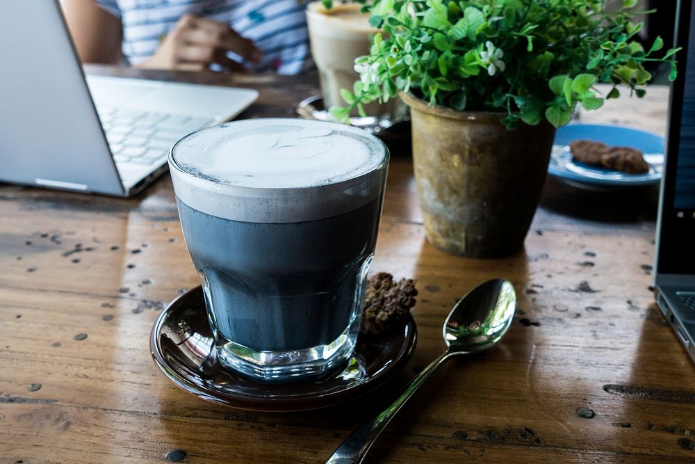 Free Charcoal cappuccino coffee on wooden table photo, public domain beverage CC0 image.