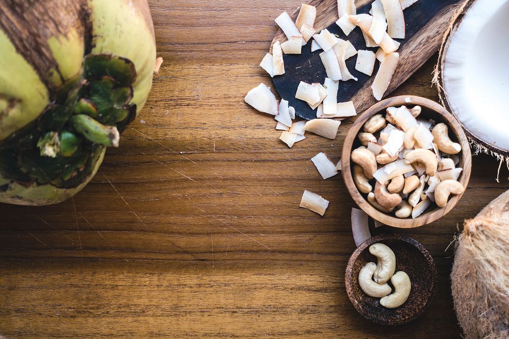 Free cashew nuts and coconut on a wooden table image, public domain food CC0 photo.