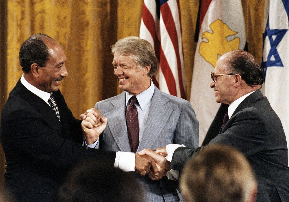 Sadat and Begin and their delegations at Camp David, September 17, 1978 (Photo courtesy of Jimmy Carter Library). Original…