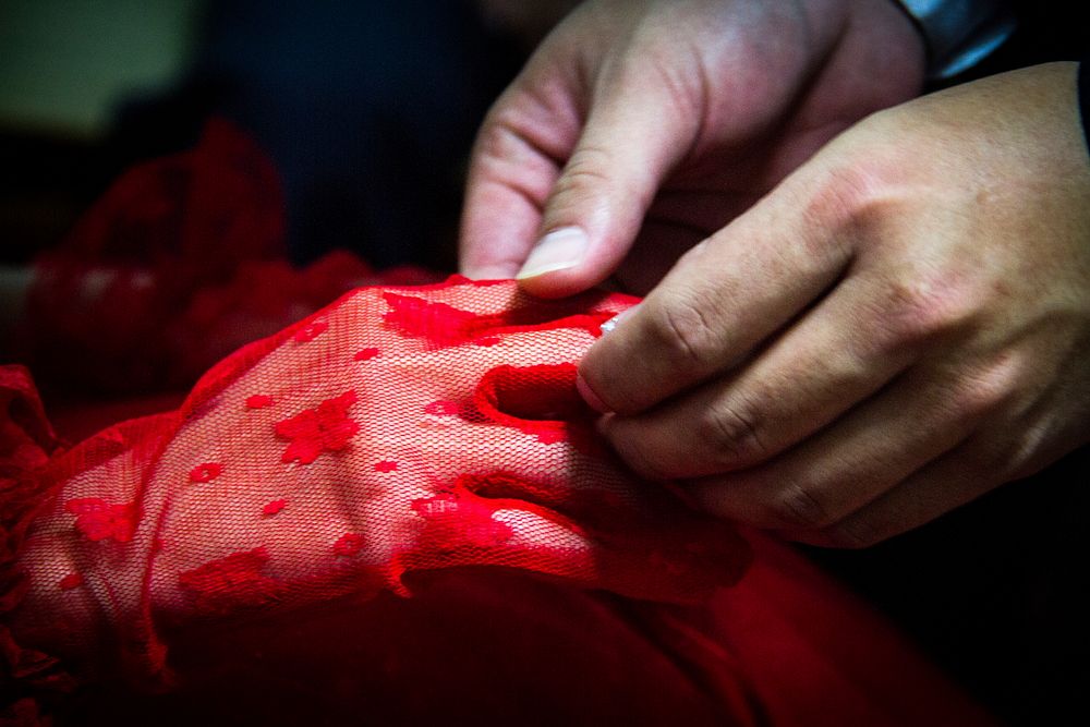 Red lae glove on hand. Free public domain CC0 photo.