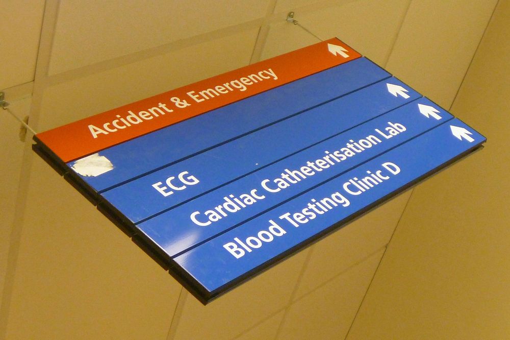 Direction sign in hospital. Original public domain image from Flickr