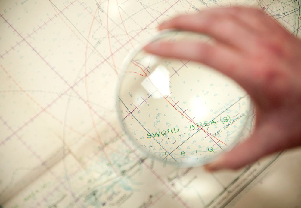 Glass globe on the nautical charts. Original public domain image from Flickr