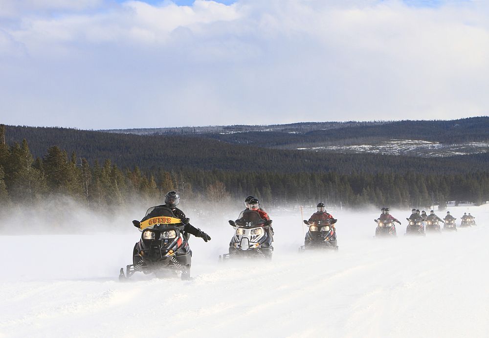Guided snowmobile group near Lower Geyser Basin by Jim Peaco. Original public domain image from Flickr