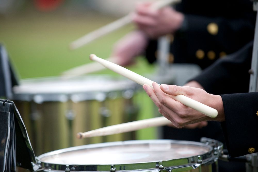 Drummer playing drum, music band. Original public domain image from Flickr