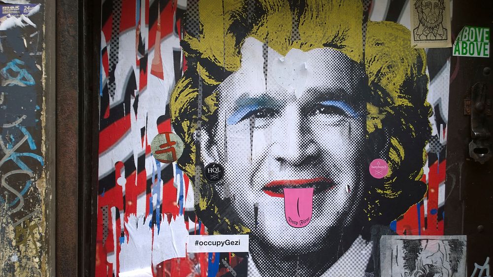 George W. Bush in a Marilyn Monroe style wig, graffiti in East London's Shoreditch area, 17th March 2014.