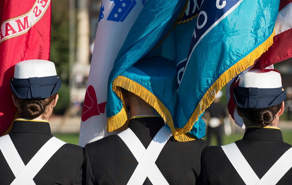 Back of cadets holding flags.Original public domain image from Flickr