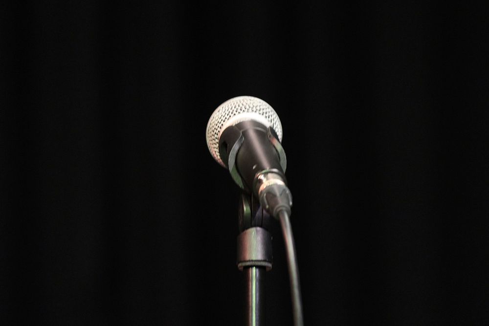 A wired microphone on a stand. Original public domain image from Flickr