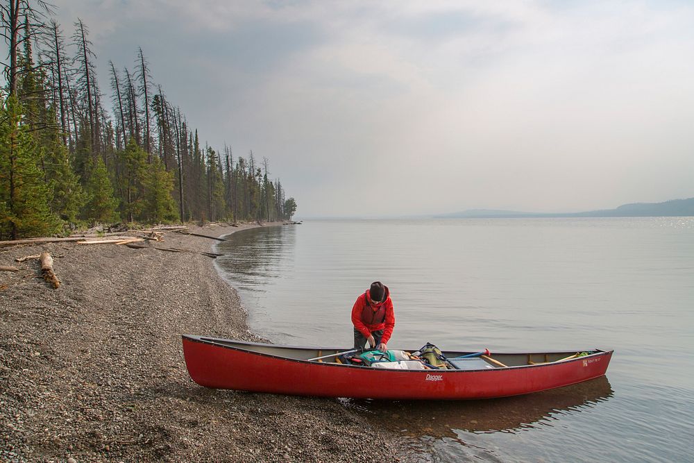 Canoeist at the southeast arm of Yellowstone Lake by Neal Herbert. Original public domain image from Flickr