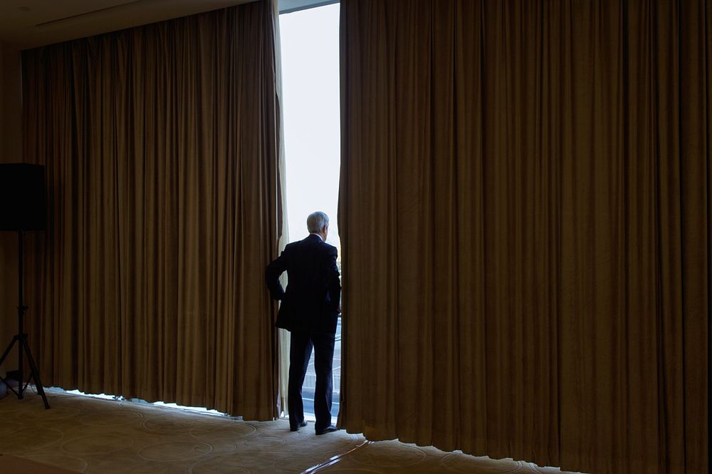 Secretary Kerry Looks Out Convention Center Window Before Bilateral Meeting With Indonesian Foreign Minister in Beijing