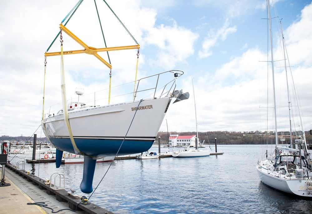 Lifting boat on a pier. Original public domain image from Flickr