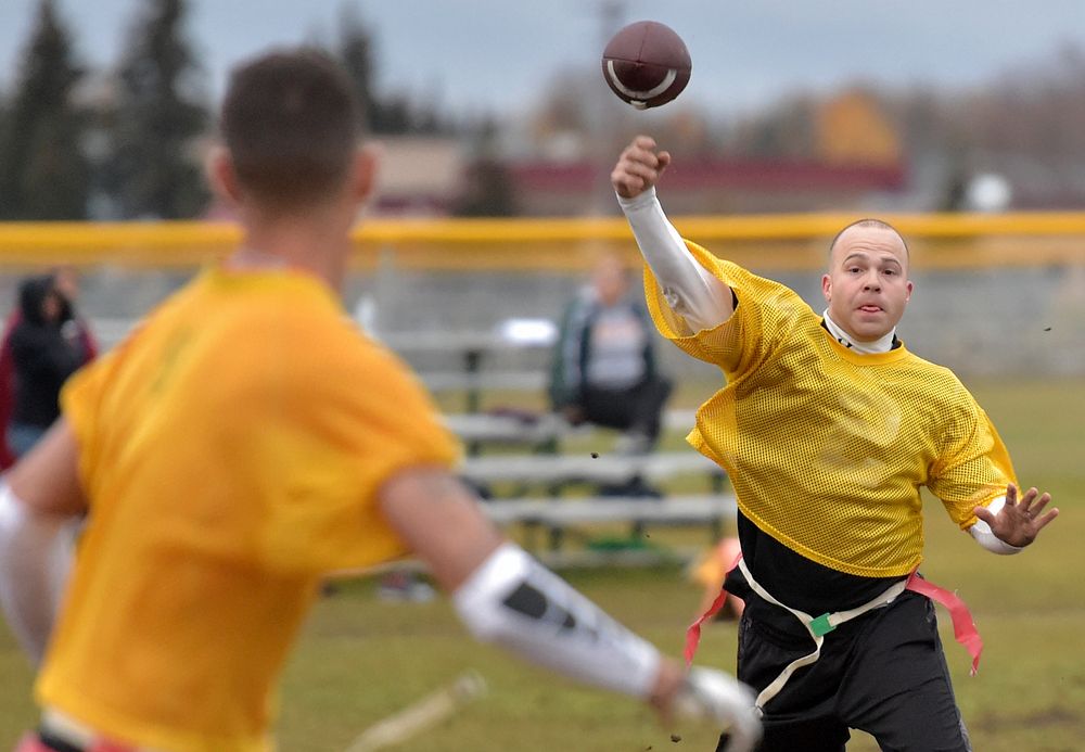 Russell Bopst Jr., Team B Company, 725th Brigade Support Battalion, passes during the intramural football championship game…