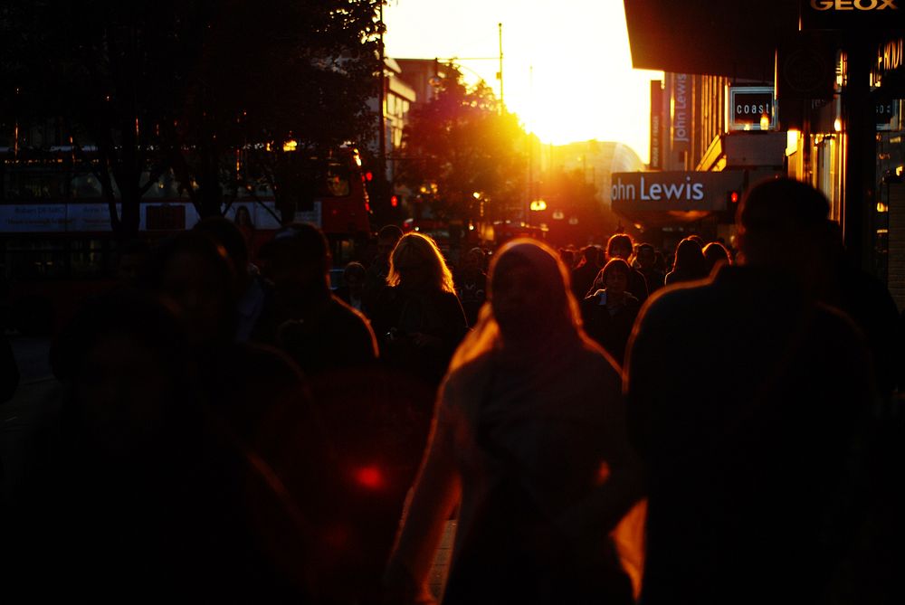 Crowds in city at sunset. Free public domain CC0 photo.