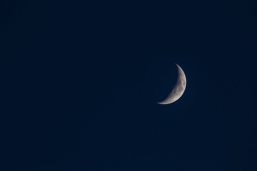 Crescent moon in dark blue sky. Free public domain CC0 image.