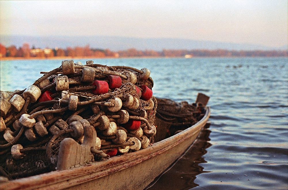 Wooden fishing boat with nets. Free public domain CC0 photo.